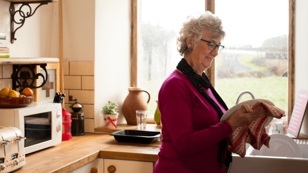 Robot Assistant - Independent Elderly Woman Doing Dishes